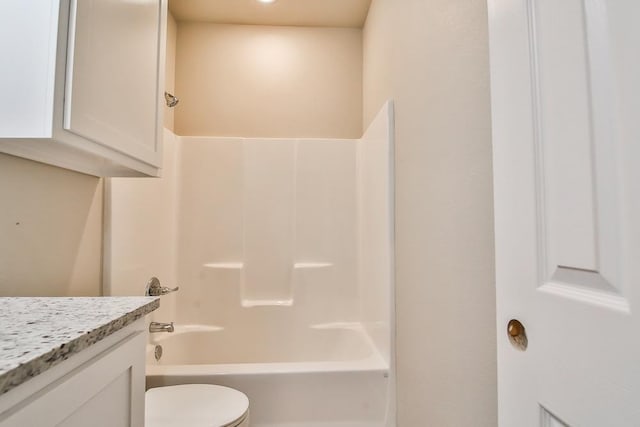 full bathroom featuring vanity, tub / shower combination, and toilet