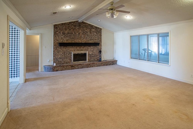 unfurnished living room with ceiling fan, a fireplace, lofted ceiling with beams, a textured ceiling, and light carpet