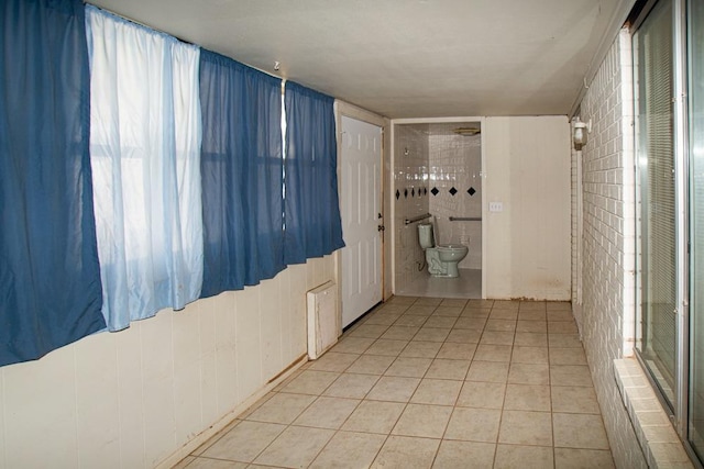 bathroom featuring tile patterned floors and toilet