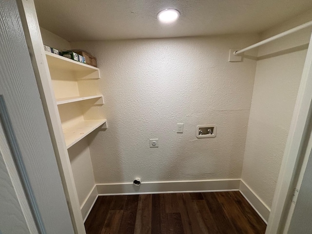 washroom with hookup for a washing machine, electric dryer hookup, and dark wood-type flooring