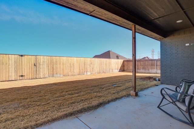 exterior space with a patio and a fenced backyard