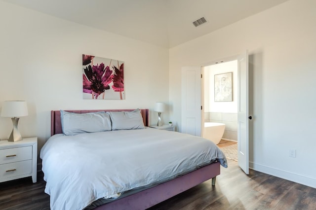 bedroom with dark wood-style flooring, baseboards, ensuite bath, and visible vents