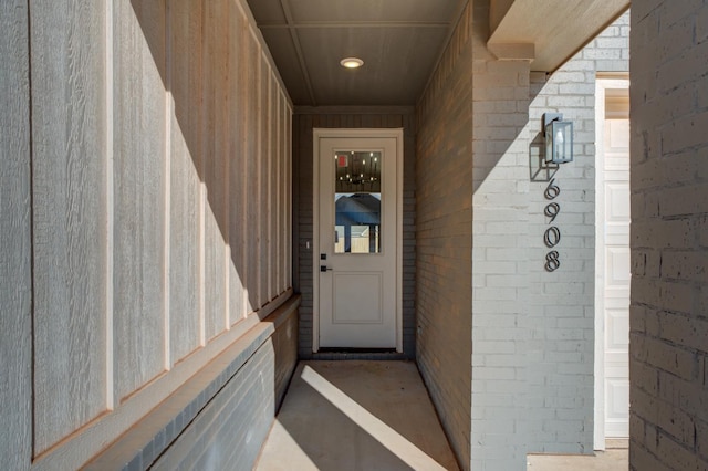 entrance to property with brick siding