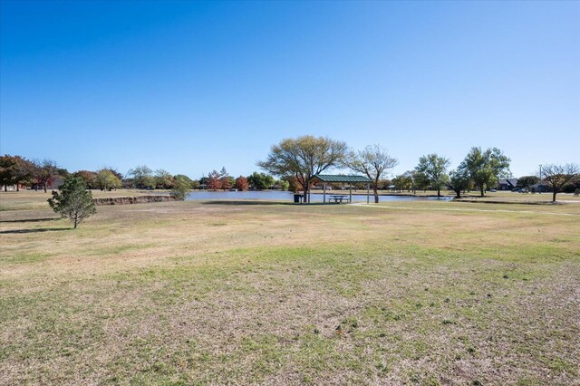 view of yard with a gazebo and a water view