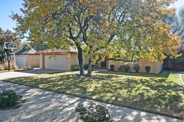 view of front of house with a garage and a front yard