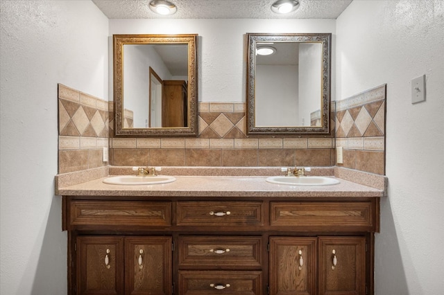 bathroom featuring vanity and a textured ceiling