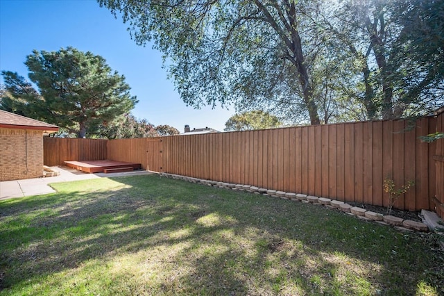 view of yard featuring a wooden deck