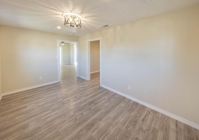 empty room featuring light hardwood / wood-style floors