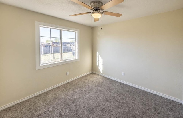 empty room with carpet floors and ceiling fan