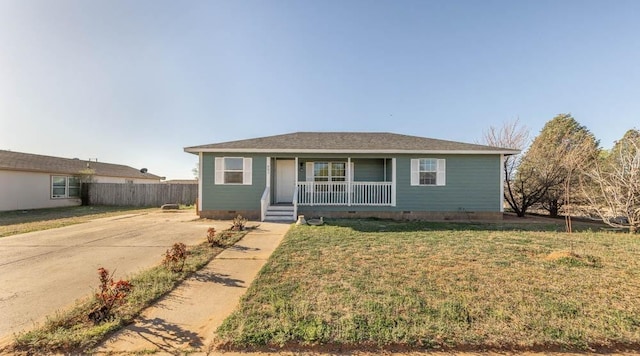 ranch-style house with a porch and a front lawn