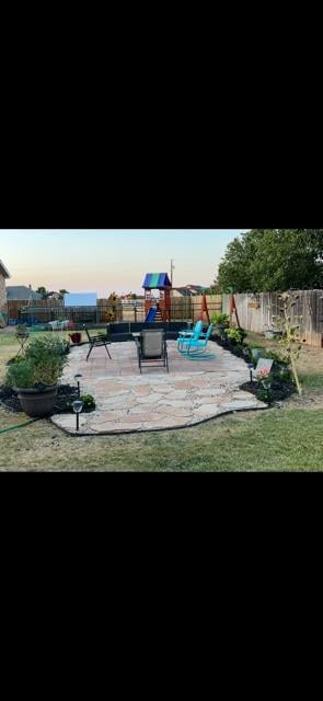 view of jungle gym with a patio