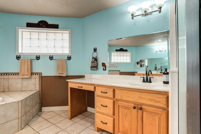 bathroom featuring vanity, tile patterned flooring, wooden walls, and a textured ceiling