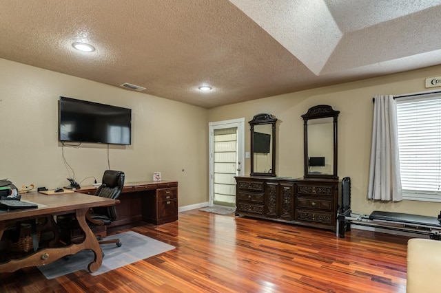 office space featuring wood-type flooring and a textured ceiling