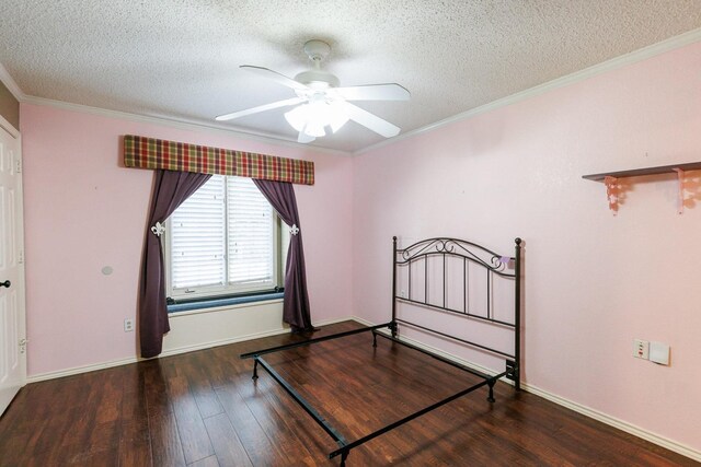 bedroom featuring crown molding, ceiling fan, dark hardwood / wood-style flooring, and a textured ceiling