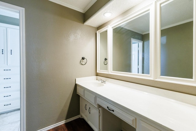 bathroom featuring ornamental molding and vanity