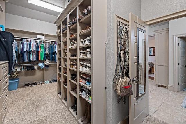 spacious closet featuring light tile patterned flooring