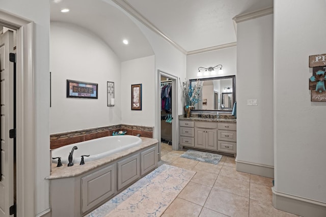 bathroom featuring vanity, a bath, and tile patterned flooring