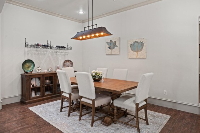 dining room featuring crown molding