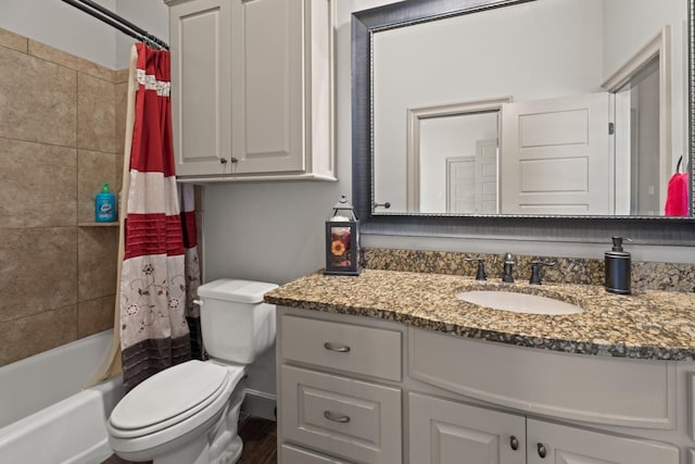 full bathroom with shower / bath combo, vanity, and toilet