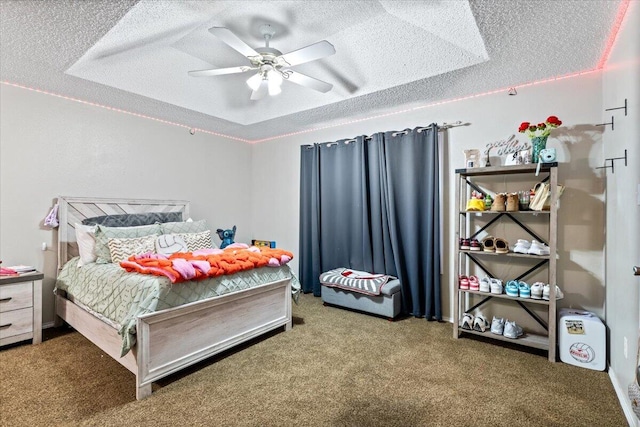 2917 Dove Ln, Denver City, TX 79323 - bedroom featuring carpet floors, a textured ceiling, and a ceiling fan