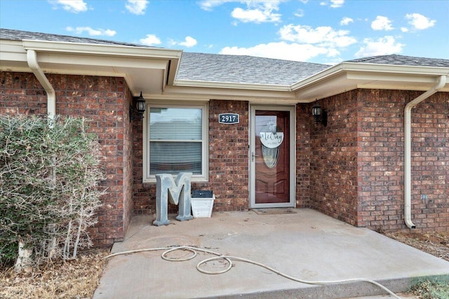 2917 Dove Ln, Denver City, TX 79323 - entrance to property with brick siding and a shingled roof