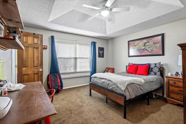 2917 Dove Ln, Denver City, TX 79323 - bedroom with a textured ceiling, carpet, baseboards, and a ceiling fan