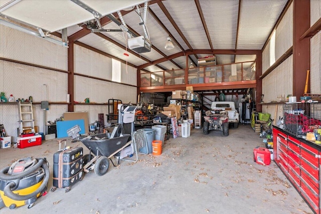 2917 Dove Ln, Denver City, TX 79323 - garage with a garage door opener and a workshop area