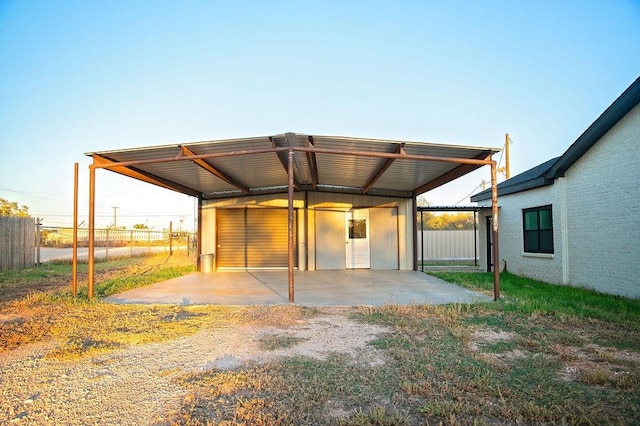 back of house with a carport