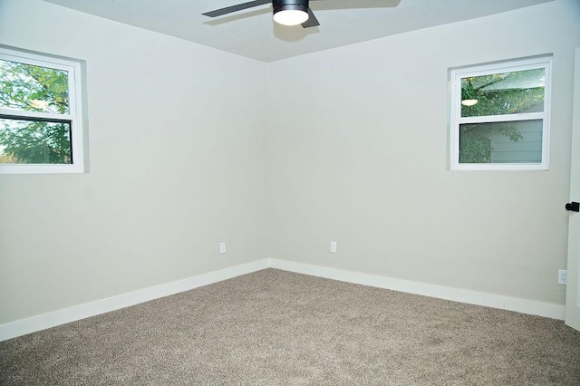 carpeted empty room with ceiling fan