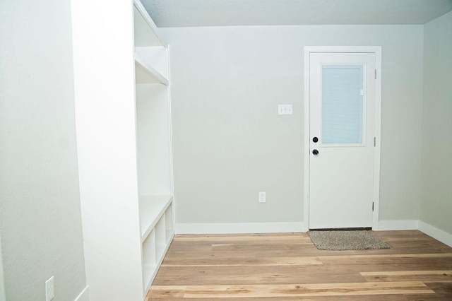 mudroom with light hardwood / wood-style flooring