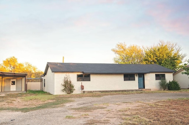 view of front of property with a carport