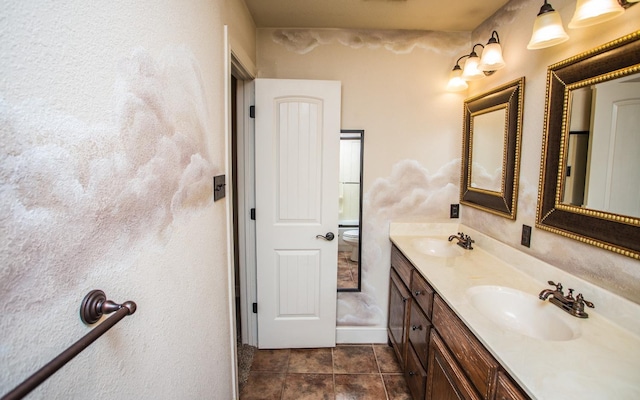 bathroom with tile patterned flooring, vanity, and toilet