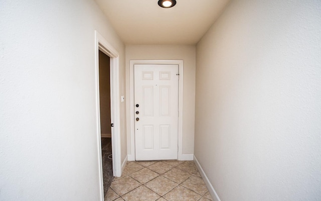 doorway featuring light tile patterned floors