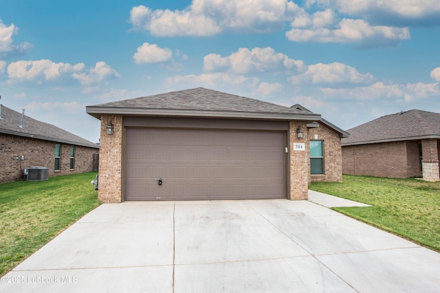 7314 29th St, Lubbock, TX 79407 - view of front of property with brick siding, driveway, a front yard, and an attached garage