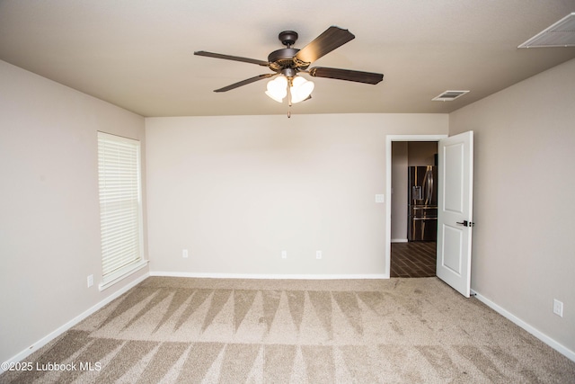 7314 29th St, Lubbock, TX 79407 - carpeted empty room with a ceiling fan and baseboards