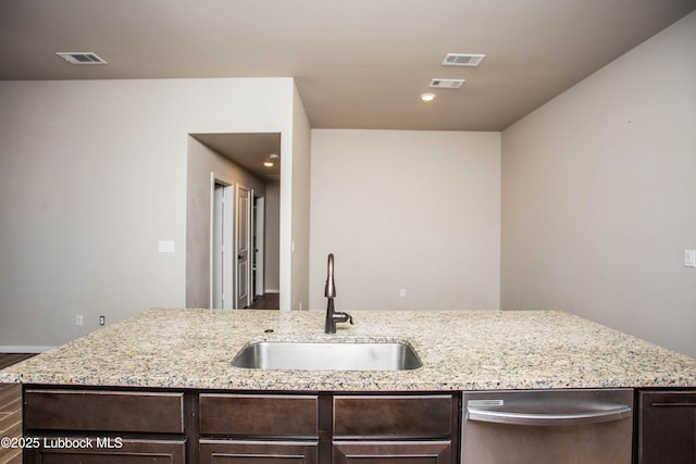 7314 29th St, Lubbock, TX 79407 - kitchen with dishwasher, dark brown cabinetry, light stone counters, wood finished floors, and recessed lighting