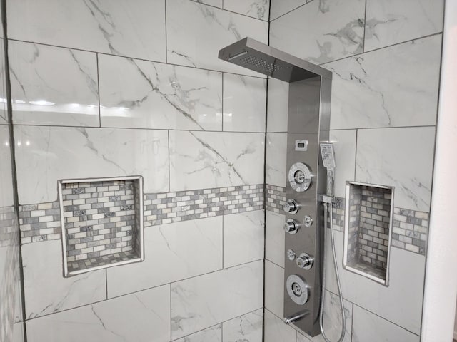 interior space featuring tiled shower