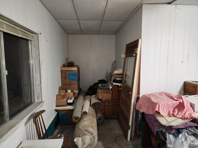 interior space with a paneled ceiling