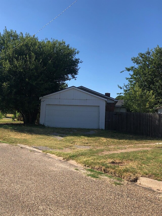 garage with a yard