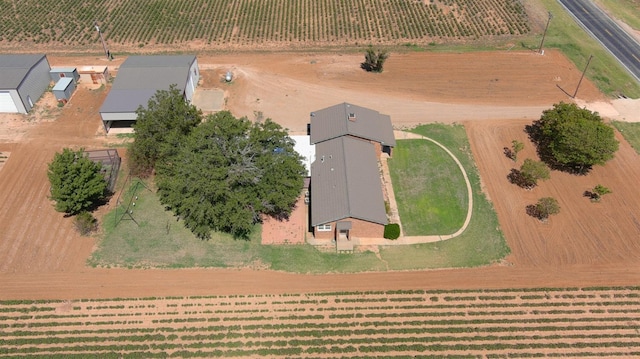 birds eye view of property with a rural view