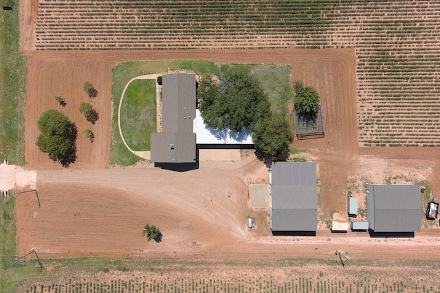 birds eye view of property with a rural view