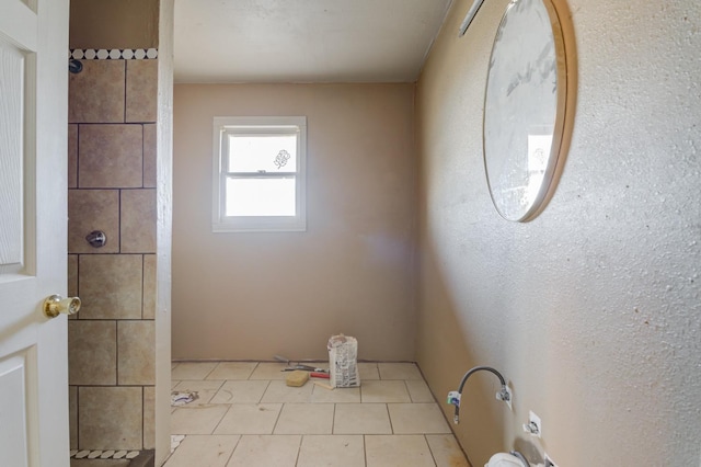 bathroom with tile patterned floors