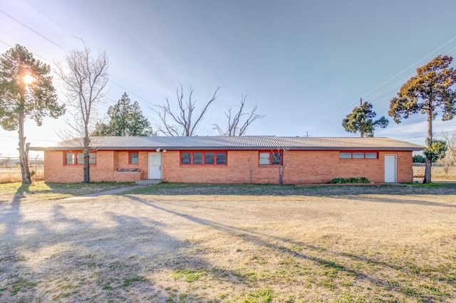 ranch-style house with a front lawn