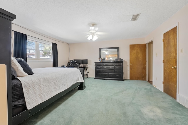 7007 Miami Ave, Lubbock, TX 79413 - carpeted bedroom featuring a textured ceiling and a ceiling fan