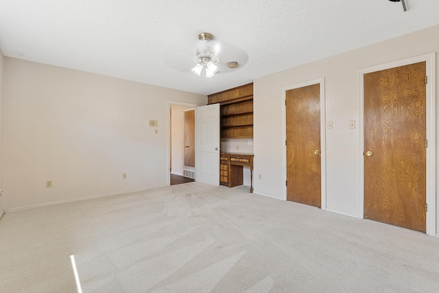 7007 Miami Ave, Lubbock, TX 79413 - unfurnished bedroom featuring carpet and a textured ceiling