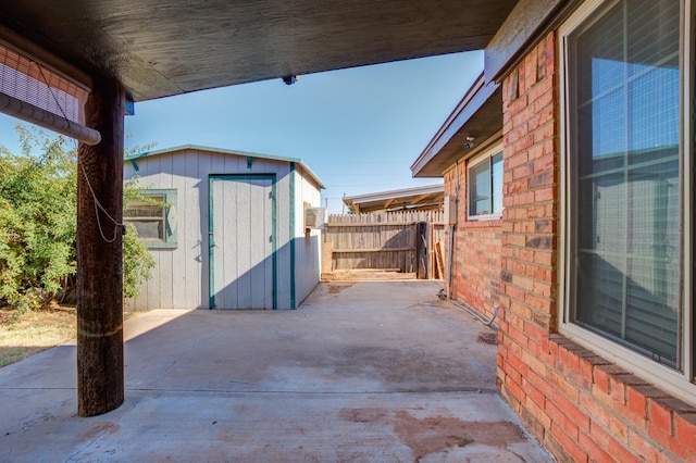 view of patio / terrace with a storage shed