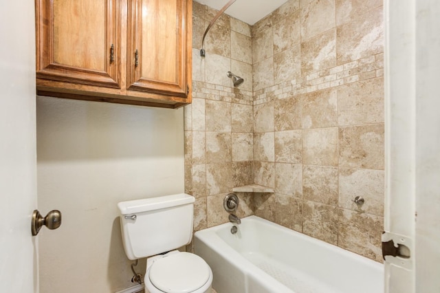 bathroom featuring tiled shower / bath and toilet