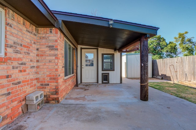 view of patio / terrace featuring a storage unit