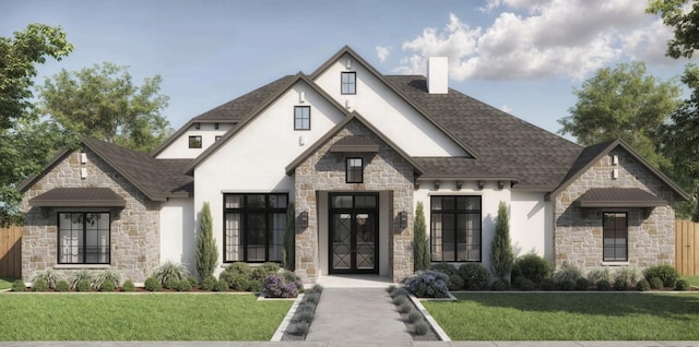 view of front facade with a shingled roof, a front yard, stucco siding, and stone siding