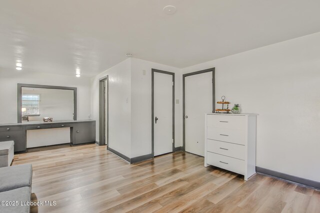 1901 31st St, Lubbock, TX 79411 - bedroom with light wood finished floors and baseboards